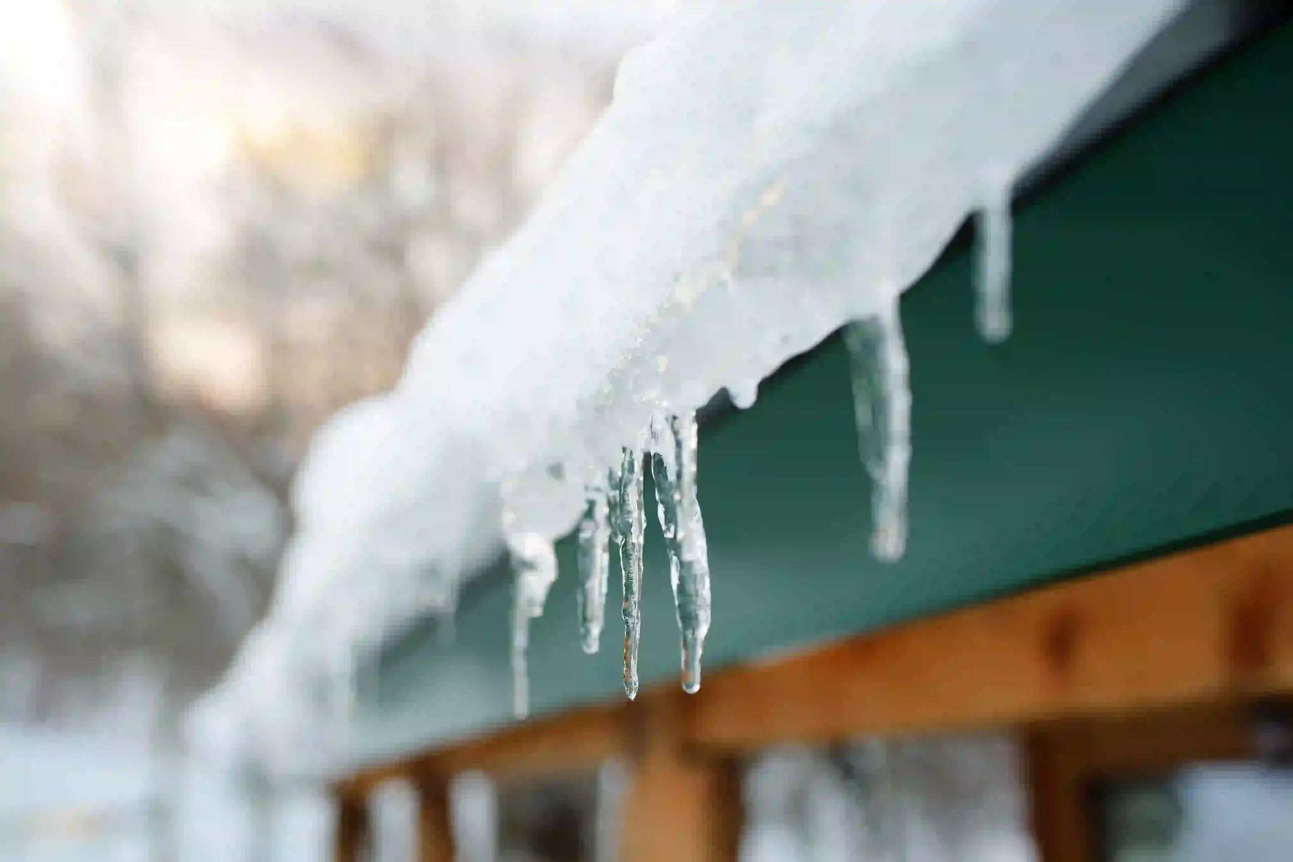 Ice dam forming on New Jersey roof eave in winter